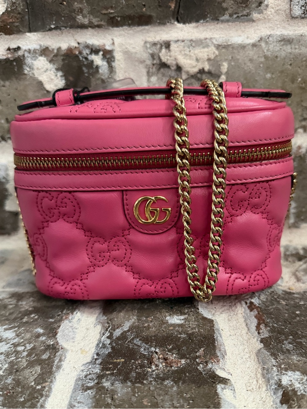 Pink Gucci GG Matelassé leather mini top handle vanity bag